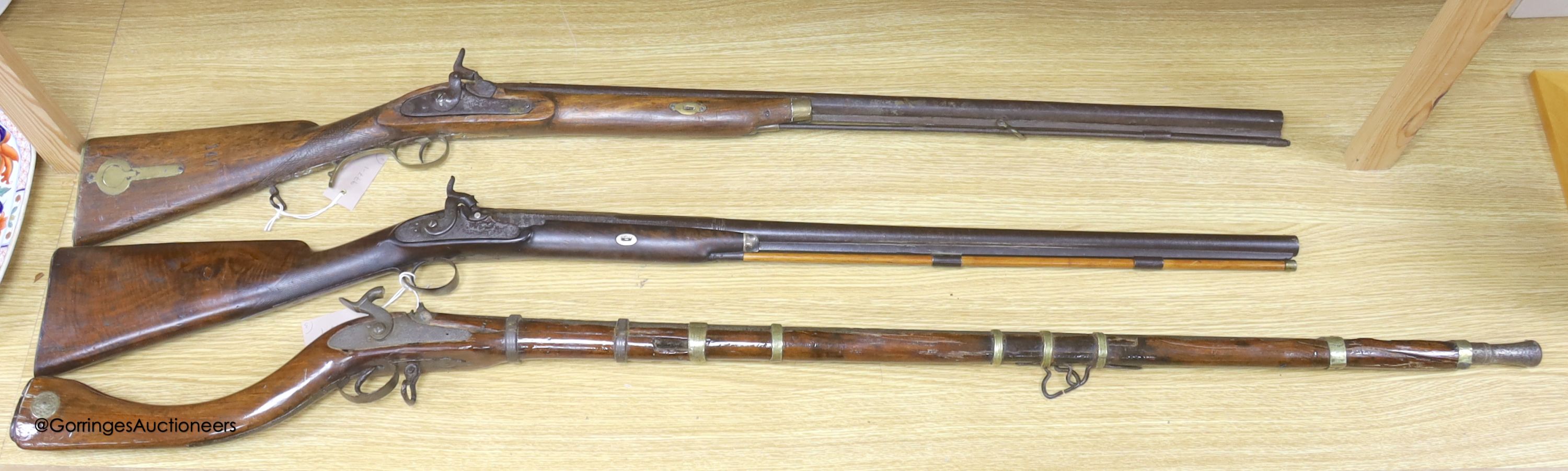 An Indian percussion rifle, an Afghan percussion rifle and a European percussion rifle, longest 140cm